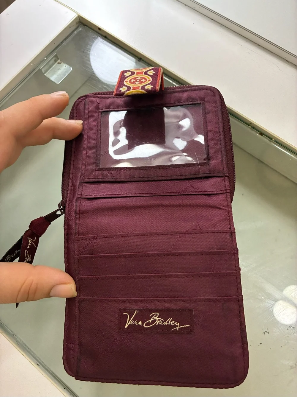 Vera Bradley Bifold Square Zip Wallet Has pink staining on back of wallet shown